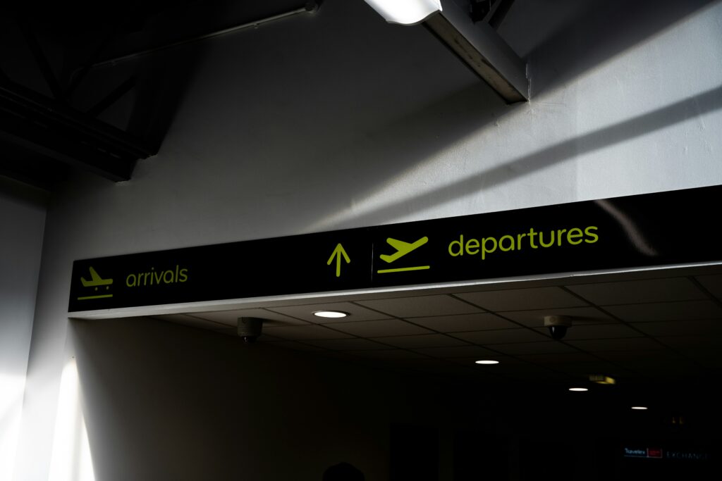An image showing a departures sign at an airport