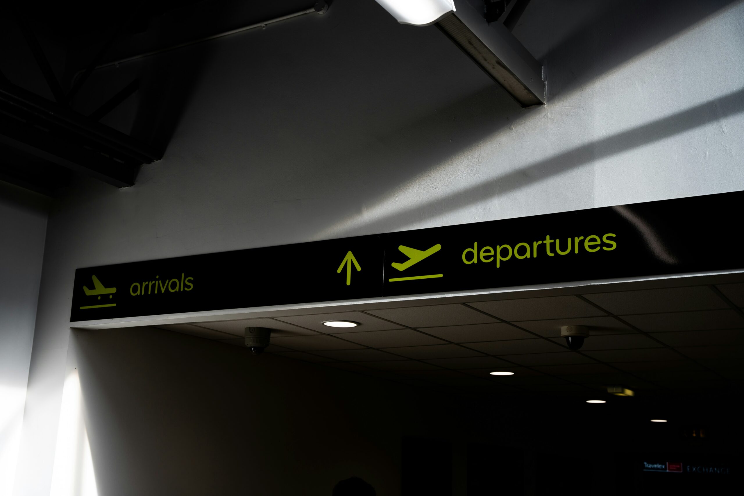 An image showing a departures sign at an airport