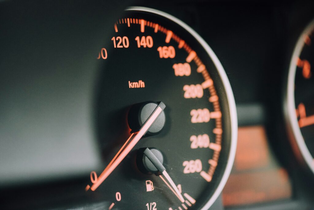 An image showing a close up of a car's speedometer