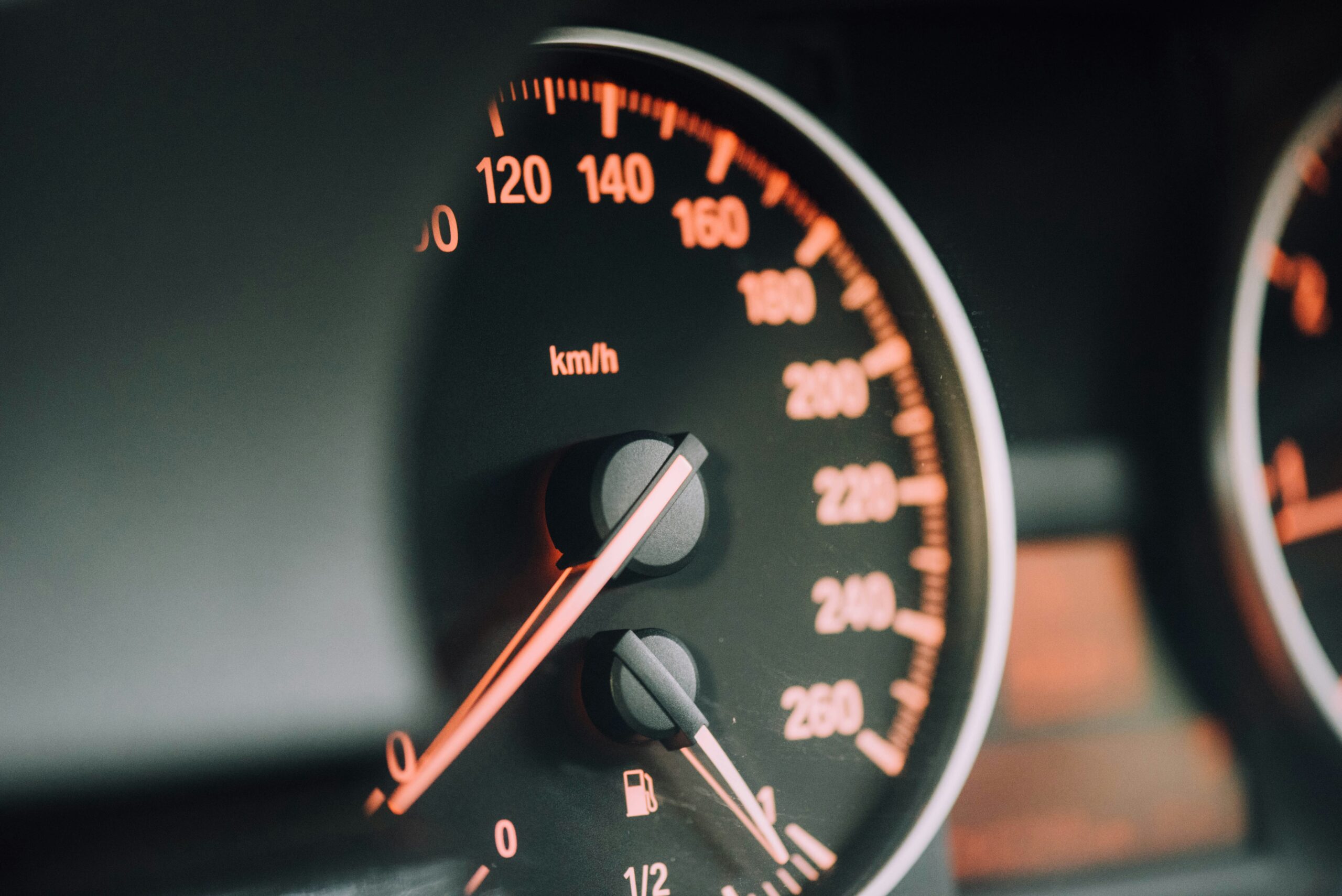 An image showing a close up of a car's speedometer